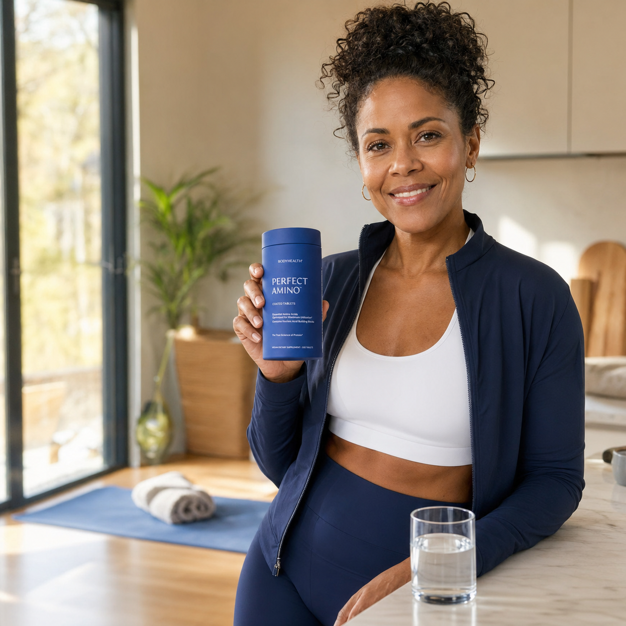 Active woman holding PerfectAmino after a morning workout